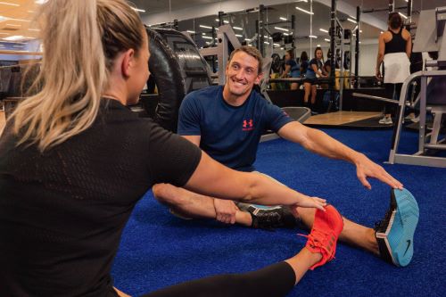 Ben training a client at Genesis Health Clubs