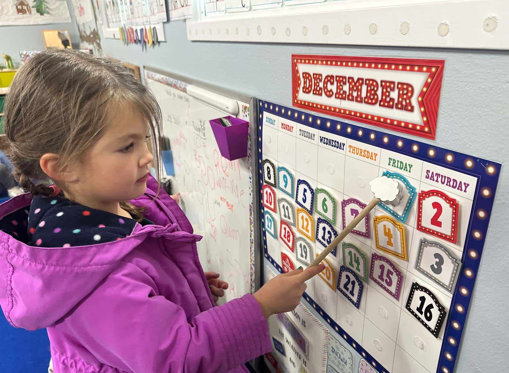 Preschool student practicing calendar skills at Genesis Preschool in Fort Collins.