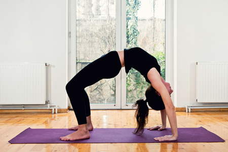 Woman doing yoga backbend