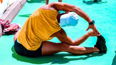 man side stretching before a big run